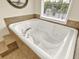 Spacious white jetted tub in bathroom at 2725 Bailey Ne Pl, Conyers, GA 30013