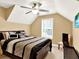 Cozy bedroom with modern bedding, decorative pillows, and a ceiling fan at 2725 Bailey Ne Pl, Conyers, GA 30013