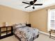 Comfortable bedroom with neutral walls, two lamps, and stylish bedspread at 2725 Bailey Ne Pl, Conyers, GA 30013