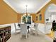 Elegant dining room with ample natural light, a decorative light fixture, and comfortable seating for formal meals at 2725 Bailey Ne Pl, Conyers, GA 30013