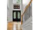 Spacious foyer featuring hardwood floors, staircase, and a grand front door with glass panels at 2725 Bailey Ne Pl, Conyers, GA 30013