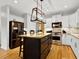 Stylish kitchen featuring an island, stainless steel appliances, granite countertops, and custom lighting for a modern feel at 2725 Bailey Ne Pl, Conyers, GA 30013