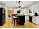 Modern kitchen with an island, stainless steel appliances, hardwood floors and sleek cabinets, ideal for cooking and gathering at 2725 Bailey Ne Pl, Conyers, GA 30013