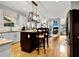 Open concept kitchen with granite countertops, an island and stainless steel appliances at 2725 Bailey Ne Pl, Conyers, GA 30013