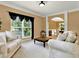 Comfortable living room with plush sofas, large windows, and stylish decor, perfect for relaxing and entertaining guests at 2725 Bailey Ne Pl, Conyers, GA 30013