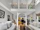 Spacious living room with open floor plan, showcasing elegant decor and seamless flow to the kitchen at 2725 Bailey Ne Pl, Conyers, GA 30013