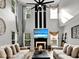 Bright and open living room with high ceilings, fireplace, and large windows, perfect for modern living at 2725 Bailey Ne Pl, Conyers, GA 30013
