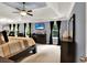 Relaxing primary bedroom featuring a tray ceiling, large windows, and dark wood furniture at 2725 Bailey Ne Pl, Conyers, GA 30013