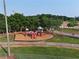 Aerial view of a fenced playground with slides and greenery at 2725 Bailey Ne Pl, Conyers, GA 30013
