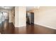 Open concept dining area with hardwood floors, chandelier, and view of the kitchen at 3262 Cascade Parc Blvd, Atlanta, GA 30311