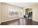 Bright dining room with large windows, chandelier, and dark hardwood floors at 3262 Cascade Parc Blvd, Atlanta, GA 30311