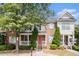 Charming townhome with brick facade, shutters, manicured shrubs, and a welcoming front porch at 3262 Cascade Parc Blvd, Atlanta, GA 30311