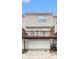 Exterior view of garage and deck of tan townhouse with white garage door at 3262 Cascade Parc Blvd, Atlanta, GA 30311