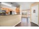 Kitchen with stainless steel appliances, wood cabinets, and an open view to the dining area at 3262 Cascade Parc Blvd, Atlanta, GA 30311