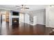 Bright living room with dark hardwood floors, fireplace, and open to the kitchen at 3262 Cascade Parc Blvd, Atlanta, GA 30311