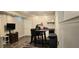 Finished basement with hard wood floors, television, eating table and chairs at 4162 Riverdale Dr, Snellville, GA 30039