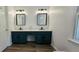 Bright bathroom features double sink vanity and stylish accent bench at 4162 Riverdale Dr, Snellville, GA 30039