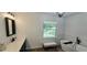 Modern bathroom with a soaking tub, stylish vanity, and ample natural light at 4162 Riverdale Dr, Snellville, GA 30039