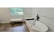Modern bathroom featuring a sleek soaking tub and stylish fixtures at 4162 Riverdale Dr, Snellville, GA 30039
