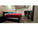 Spacious bedroom with dark hard wood floors, comfy queen bed and fire place, offering a relaxing retreat at 4162 Riverdale Dr, Snellville, GA 30039