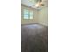 Bedroom with carpet, ceiling fan and light filled window at 4162 Riverdale Dr, Snellville, GA 30039