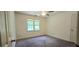 Bedroom with carpet, ceiling fan and light filled window at 4162 Riverdale Dr, Snellville, GA 30039