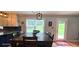Dining area featuring a large table, bright windows, and backyard views at 4162 Riverdale Dr, Snellville, GA 30039