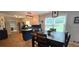 Dining area with a large table, hardwood floors, and bright windows at 4162 Riverdale Dr, Snellville, GA 30039
