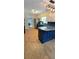 Updated kitchen boasting stainless appliances, granite counters, island, and hardwood floors at 4162 Riverdale Dr, Snellville, GA 30039