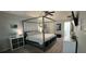 Large main bedroom featuring a canopy bed, soft carpet, and ample natural light at 4162 Riverdale Dr, Snellville, GA 30039