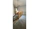 Carpeted staircase with wood railing and neutral paint at 4162 Riverdale Dr, Snellville, GA 30039