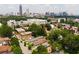 Overhead view of neighborhood featuring tree lined street with a beautiful city skyline at 504 Angier Ne Ave, Atlanta, GA 30308