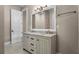 Bathroom featuring double sinks, modern vanity, and a large framed mirror at 504 Angier Ne Ave, Atlanta, GA 30308