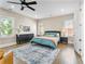 Bright bedroom features hardwood floors, a ceiling fan, and natural light from the windows at 504 Angier Ne Ave, Atlanta, GA 30308