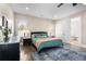 Brightly lit bedroom featuring hardwood floors, a ceiling fan, and natural light from the windows at 504 Angier Ne Ave, Atlanta, GA 30308