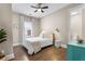 Cozy bedroom with hardwood floors, natural light, and adjacent bathroom at 504 Angier Ne Ave, Atlanta, GA 30308