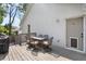 Back deck with a dining table and chairs and featuring a convenient entry door at 504 Angier Ne Ave, Atlanta, GA 30308
