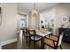 The dining room features a modern light fixture and views to the kitchen and bedroom at 504 Angier Ne Ave, Atlanta, GA 30308