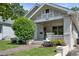 Charming white brick home with a well-manicured lawn and lush landscaping at 504 Angier Ne Ave, Atlanta, GA 30308