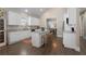 Bright kitchen features white cabinetry, granite countertops, and a center island with bar seating at 504 Angier Ne Ave, Atlanta, GA 30308