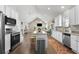 Open concept kitchen with stainless steel appliances, granite countertops and views to the living area at 504 Angier Ne Ave, Atlanta, GA 30308