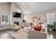 Open living room with a fireplace, hardwood floors, and abundant natural light at 504 Angier Ne Ave, Atlanta, GA 30308