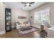Cozy living room featuring hardwood floors, modern decor, and natural light from a large window at 504 Angier Ne Ave, Atlanta, GA 30308