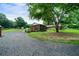 Scenic view of the backyard with an enclosed wooden porch and mature landscaping at 81 Laurie Ct, Hiram, GA 30141