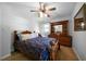 Bedroom with carpet flooring, a ceiling fan, and a wood dresser at 81 Laurie Ct, Hiram, GA 30141
