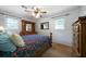Bedroom with carpet flooring, a ceiling fan, and light neutral walls at 81 Laurie Ct, Hiram, GA 30141