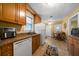 Efficient kitchen featuring tile floors, wood cabinets, and a dining nook at 81 Laurie Ct, Hiram, GA 30141