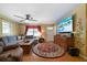 Inviting living room featuring a cozy sitting arrangement and natural light at 81 Laurie Ct, Hiram, GA 30141