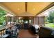 Covered patio with wood floors and screens, perfect for outdoor cooking with several grills at 81 Laurie Ct, Hiram, GA 30141