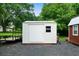 Durable white metal shed with side door, perfect for storage and organization of outdoor items at 81 Laurie Ct, Hiram, GA 30141